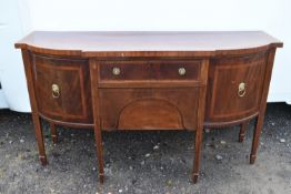 A Georgian mahogany and satinwood inlaid sideboard.