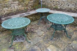 Three pierced wrought metal and painted garden tables. H.67 W.86cm (largest) (3)