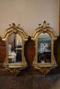 A pair of 19th century pier mirrors in scrolling foliate gilt frames with fern leaf cresting. H.