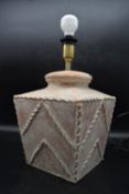 A contemporary stone terracotta Inthai 'Cordele' table lamp with brass stem and arrow shape
