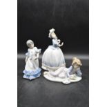 A set of three 20th century 'Lladro' lady figures in classical forms, with makers marks to base. H.