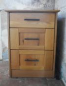 A contemporary light oak three drawer filing cabinet. H.70 W.52 D.50cm