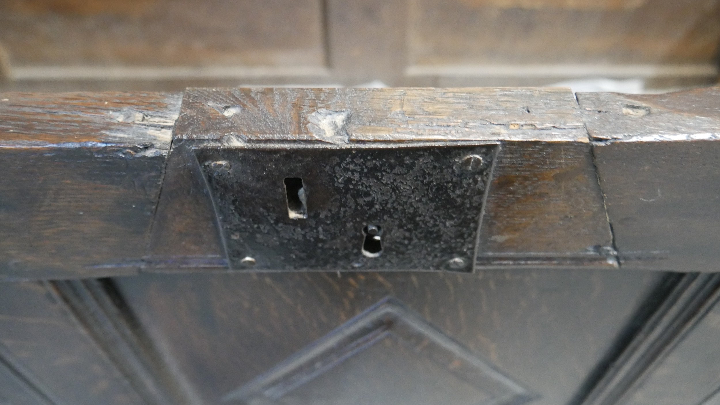 A 17th century oak coffer with lozenge carved panels raised on stile supports. H.54 W.104 D.49cm - Image 9 of 11