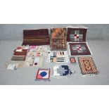 An assortment of handmade small Oriental rugs and other weavings. L.57 W.67cm (largest)