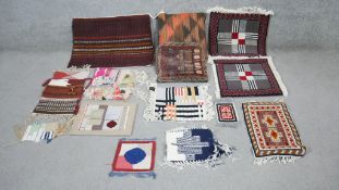 An assortment of handmade small Oriental rugs and other weavings. L.57 W.67cm (largest)