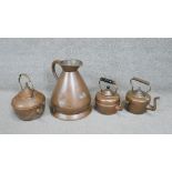 A collection of copper. Including three copper kettles and a copper gallon jug. H.36 W.30cm (