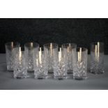A set of nine hand cut crystal highball glasses with stylised foliate design. H.15cm