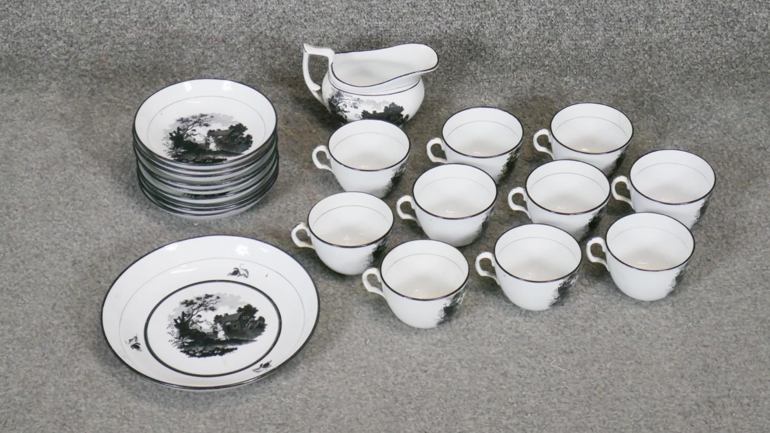 A Victorian black and white transfer printed and hand painted ten person part porcelain tea set (one