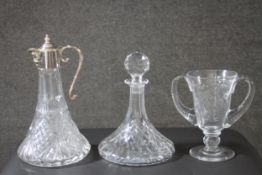 A collection of cut glass and crystal. Including a crystal ships decanter, a silver plated cut glass