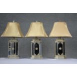 Three Indian style gilded and mirrored panel hexagonal table lamps with gold silk shades. H.71cm