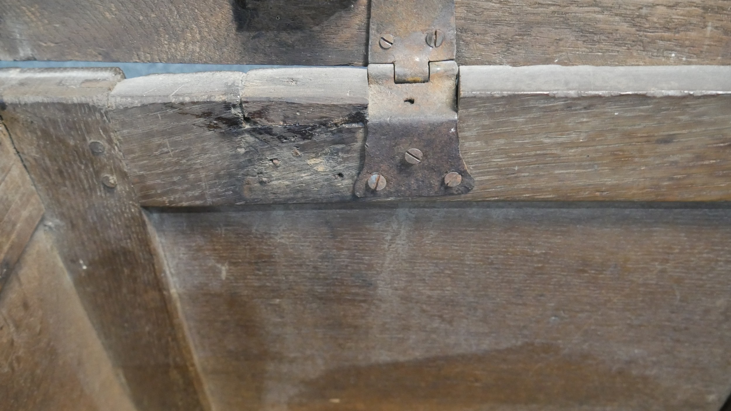 A 17th century oak coffer with lozenge carved panels raised on stile supports. H.54 W.104 D.49cm - Image 11 of 11