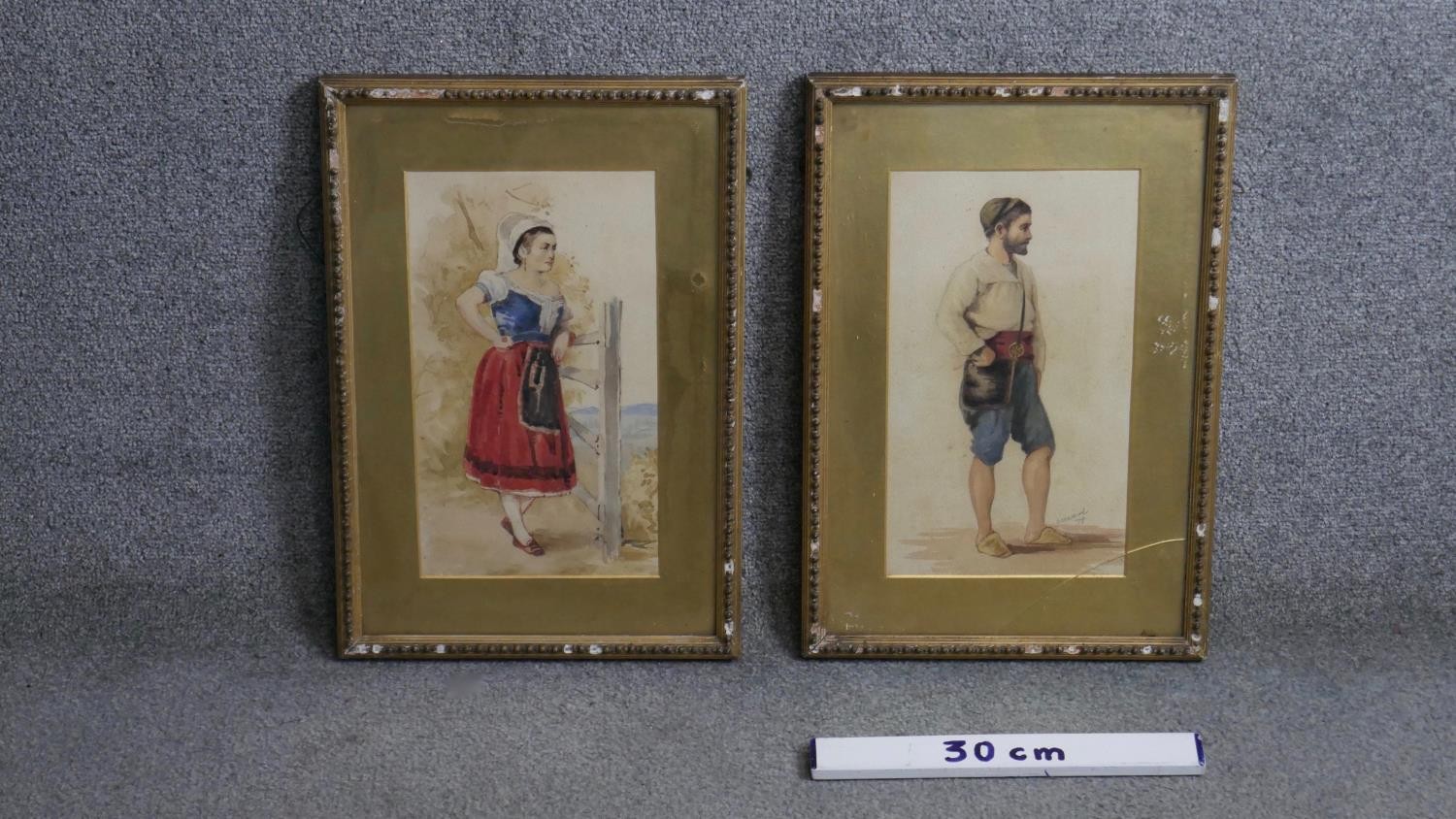 Two 19th century gilt framed and glazed watercolours of two figures in traditional costume.