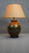 A pierced foliate design brass vase shaped table lamp with shade. H.188 D.30cm