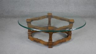 A Continental style walnut coffee table with plate glass top. H.43 W.130 D.80