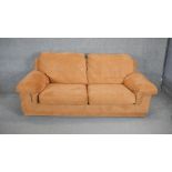 A contemporary two seat sofa in faux suede upholstery. H. 90 W. 205 D. 100