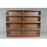 A mid century vintage teak Simplex four section bookcase with sliding plate glass doors. H.145 W.183
