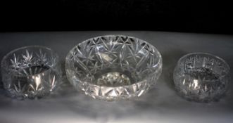 Three hand cut heavy crystal fruit bowls with stylised foliate design. Diam. 21 (largest)