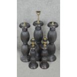 Four carved and stained table lamps with ridged bulbous design. H.53CM