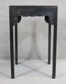 A Chinese hardwood occasional table with carved frieze and fitted drawer on square supports. H.88