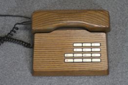 A mid-century Swiss Gfeller Trub elm telephone.