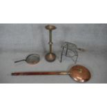 A large Victorian oak and copper bed warmer along with a brass floor standing weighted ash tray, a