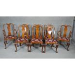 A set of eight mid century Georgian style burr walnut dining chairs with shaped vase back splats