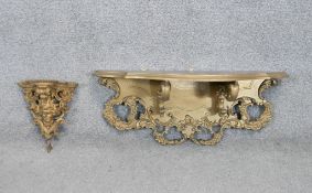 Two giltwood shelves. One Victorian with a carved figural figure and foliate motifs. L.30 W.73 D.