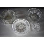 A collection of hand cut crystal. Including two fruit bowls, a serving dish and a water jug. Diam.