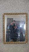 A wall mirror in gilt gesso frame. H.50 W.39cm