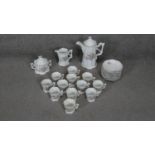 A transfer printed twelve person porcelain Lilac and Lily of the valley design coffee set. (28