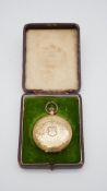 A cased antique Swiss 14 carat gold men's engraved pocket watch. Interior metal plate and gold