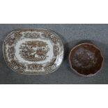 A large 19th century brown and white transfer design meat platter along with a stoneware jelly mould