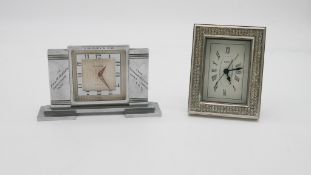 Two clocks. One Art Deco vintage CYMA 8 days chrome mantle clock with engraved inscription. (no