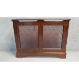 A contemporary stained teak radiator cover. H.87 W.110 D.23 CM