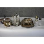 A collection of silver plate. Including a twin handled serving tray, a cut crystal cruet set, a