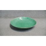 A large Chinese green crackle glaze ceramic charger. Diam.42cm