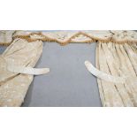 A pair of gold silk velour foliate design curtains with pelmet and tie backs. Silk tassel edging