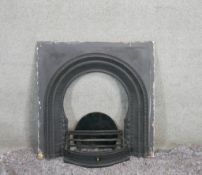 A cast iron fire place with foliate and floral motifs and cast iron hearth. H.96 W.95 CM