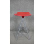 A contemporary revolving high stool with moulded seat on metal base. H.63 x W.33cm