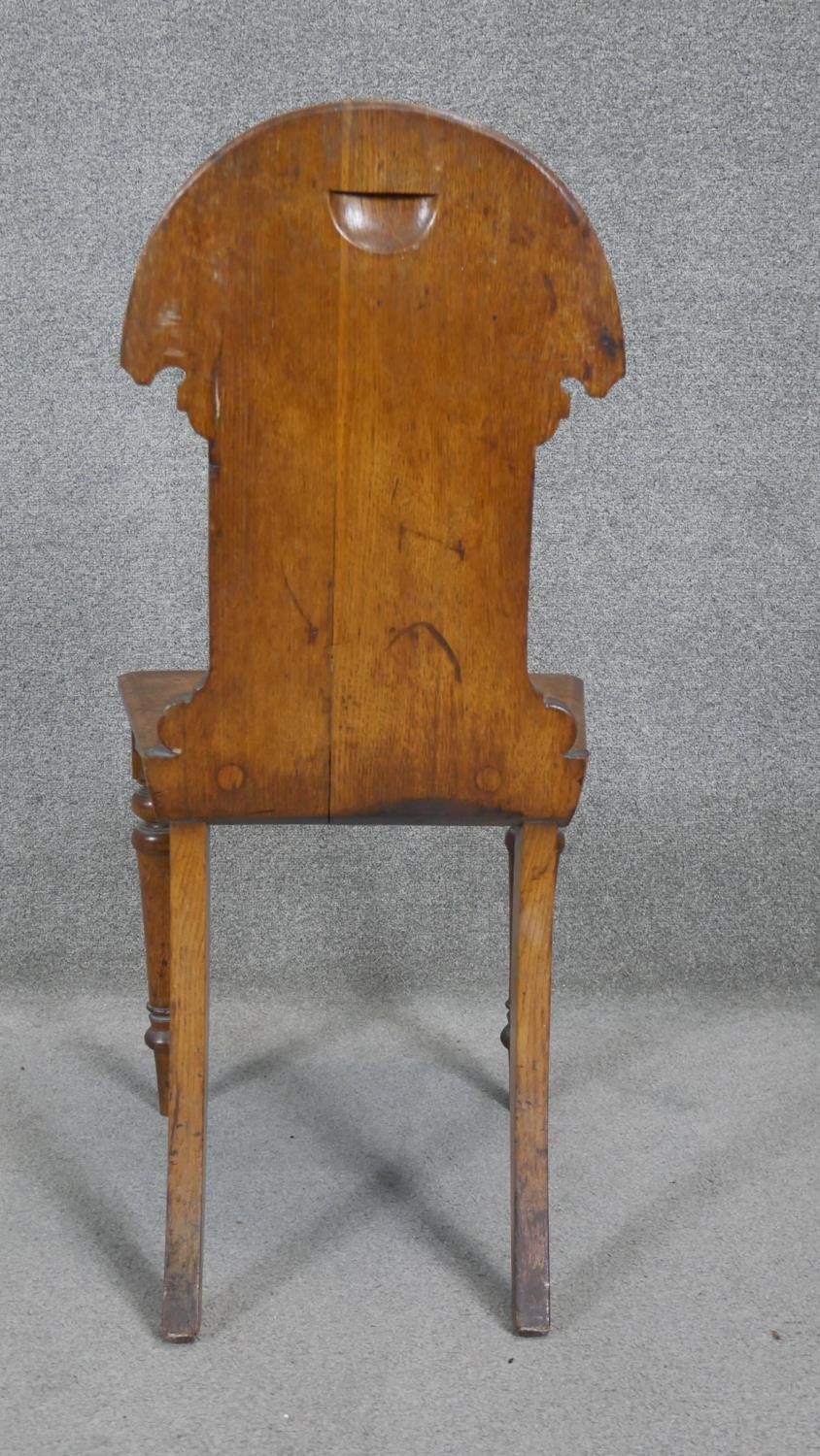 A late 19th century oak hall chair with inset Mintons tile to the back above panel seat on turned - Image 3 of 7