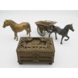An Indian pierced brass trinket box with carrying handle along with a brass horse and cart and