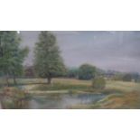 A framed and glazed pastel, parkland scene with lake, indistinctly signed. H.63 W.71cm