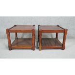 A pair of stained hard wood occasional tables on square chamfered supports united by undertier. H.40