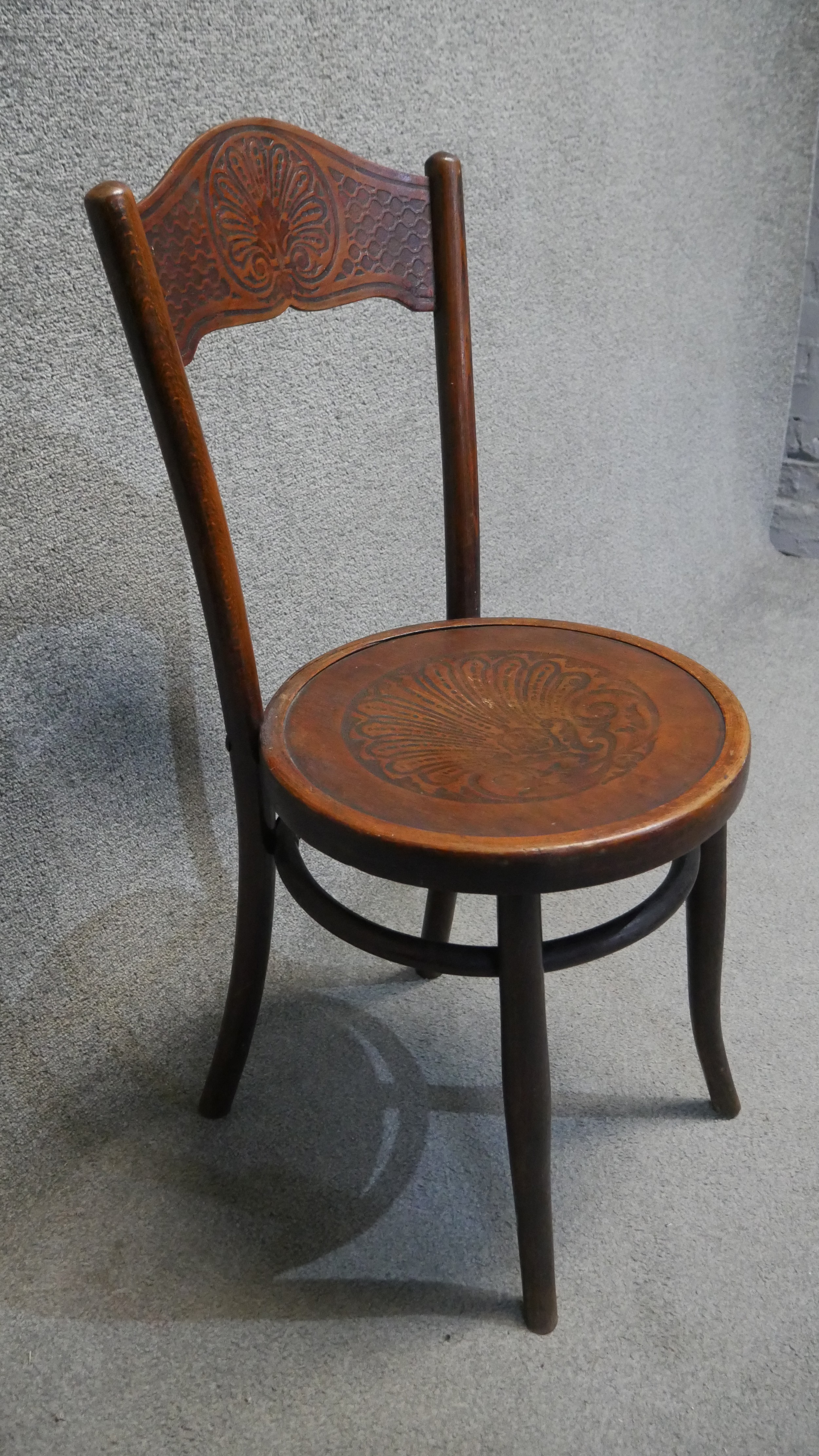 A set of four Mundus 19th century bentwood dining chairs with embossed backs and seats. - Image 4 of 5