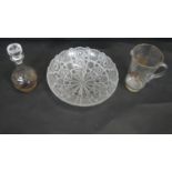 A collection of glass. Including a cut crystal fruit bowl, a Bohemian gilded glass jug and a pressed