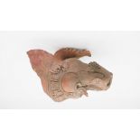 An Oriental terracotta mythical creatures head. H.30 W.19cm