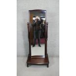 A contemporary cheval mirror with adjustable swing plate on platform base. H.153 W.63 D.44 CM