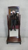 A contemporary cheval mirror with adjustable swing plate on platform base. H.153 W.63 D.44 CM