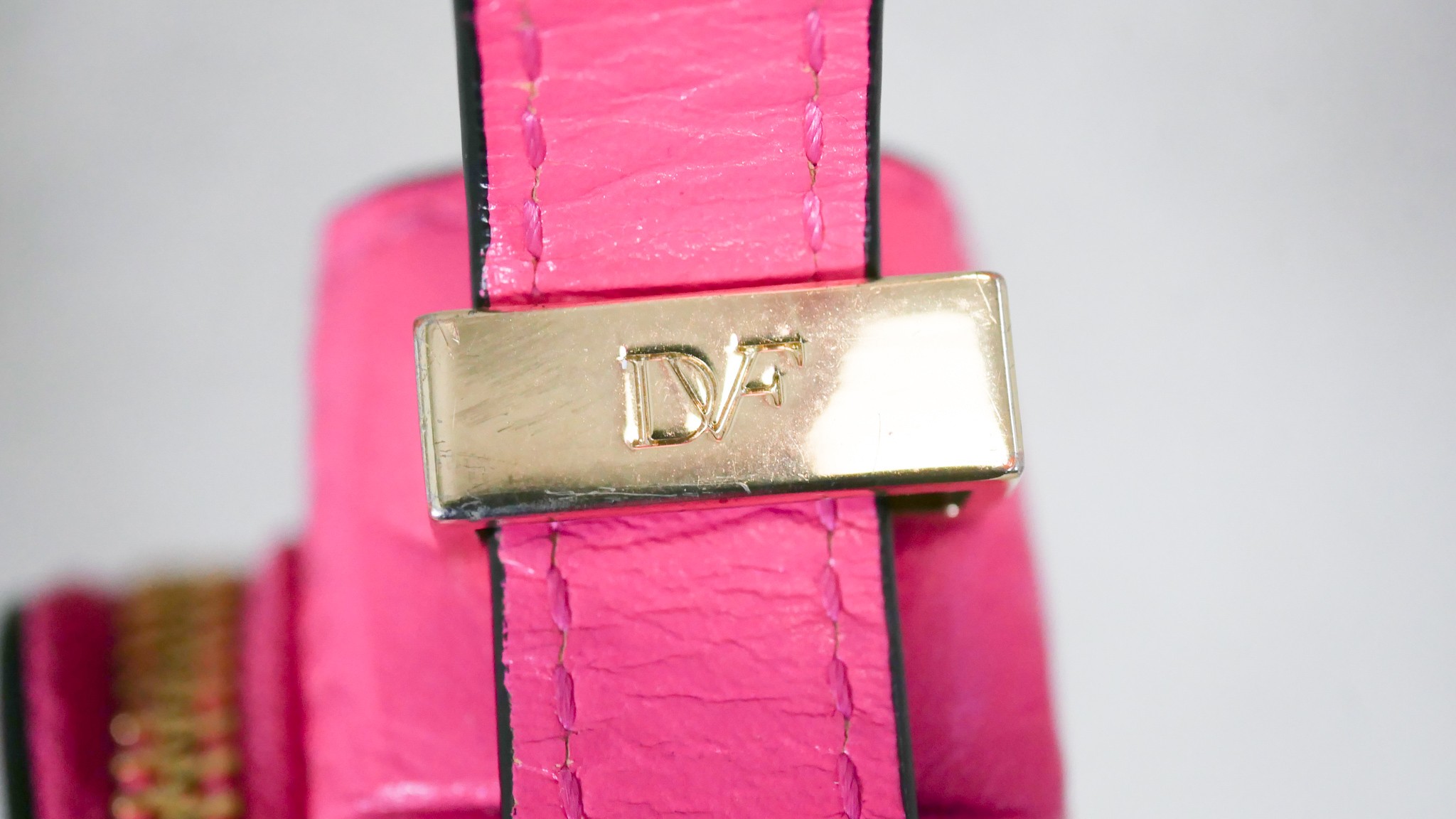 A neon pink Diane Von Furstenberg embossed leather crossbody bag. Brass Hardware and gilded name. - Image 6 of 9