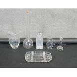 A collection of glassware. Including a dressing table tray, cut glass decanter, candle stick and